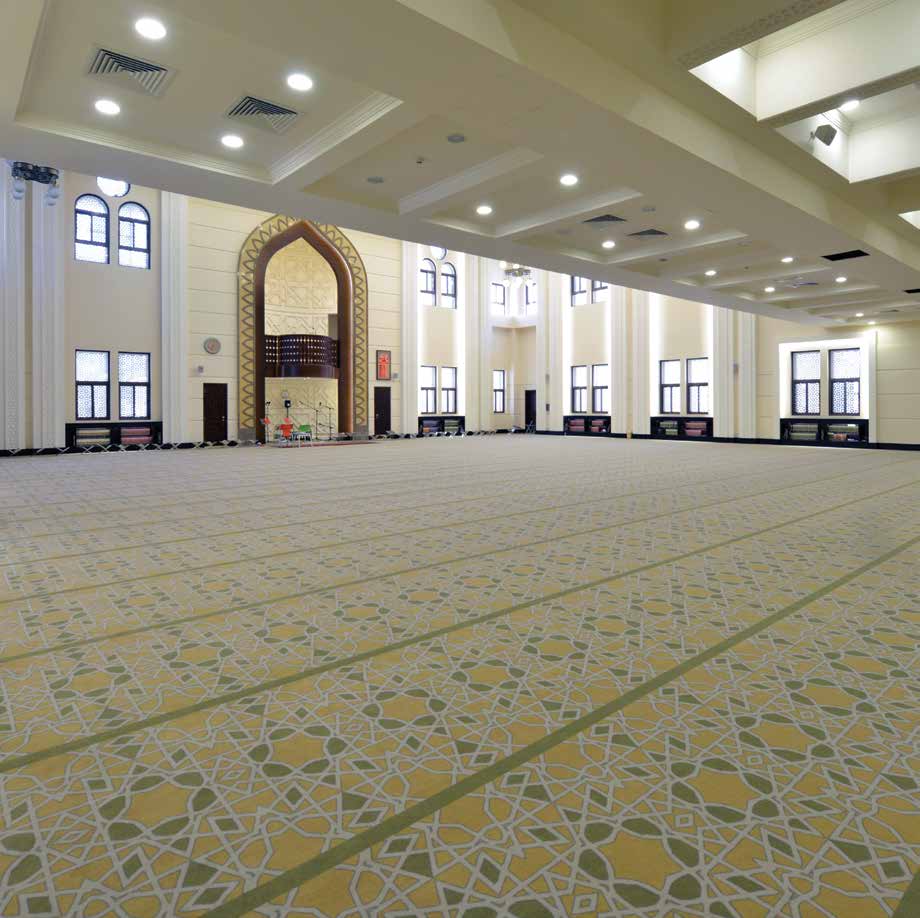 Mosque prayer hall with custom Islamic pattern carpet