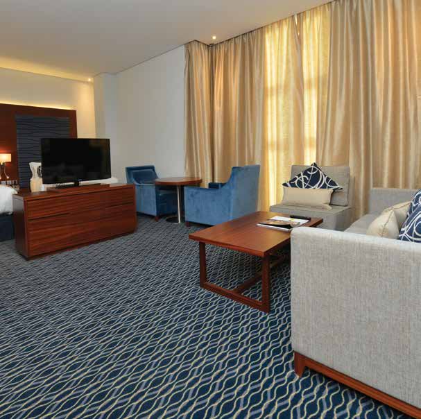 Hotel suite with blue patterned carpet