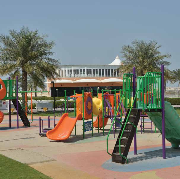 Outdoor playground with slides and climbing structures