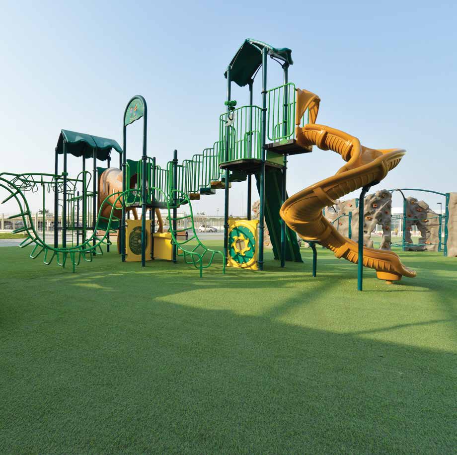 Playground with slides on artificial turf