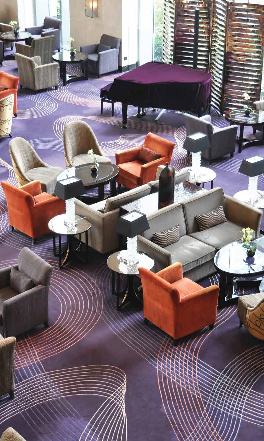 Hotel lobby with designer carpet and grand piano