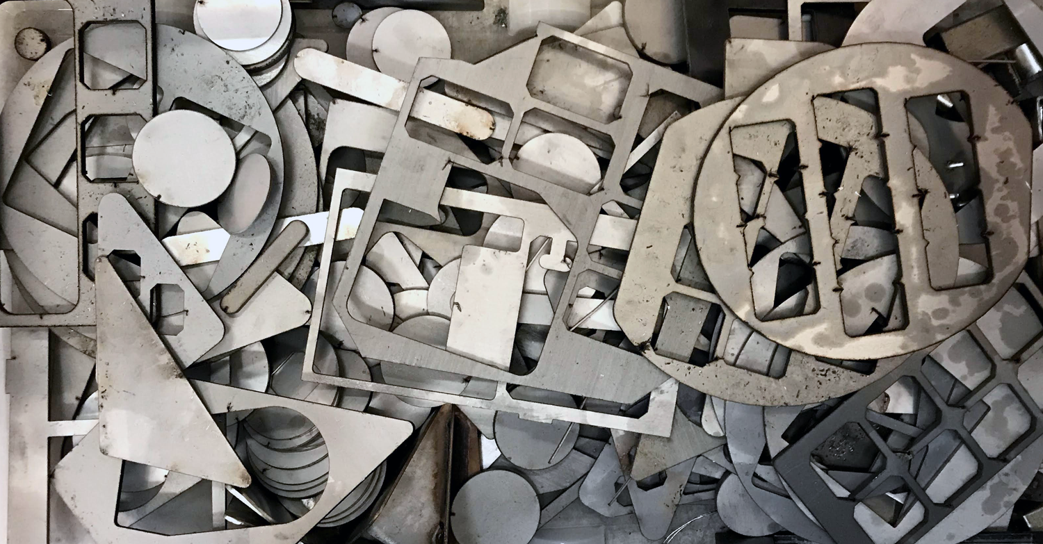 CNC-cut stainless steel scrap pieces from BFG Metal - discs, rectangles, and perforated sheets