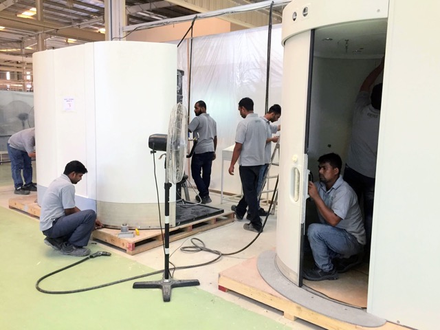 BFG technicians assembling toilet cabin modules